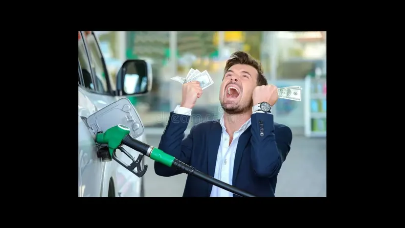 A man in a suit at a petrol pump, ecstatic, holding cash